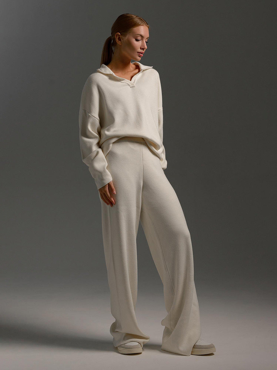 Women's knitted lounge set showing wide-leg trousers and relaxed long-sleeved top, side view