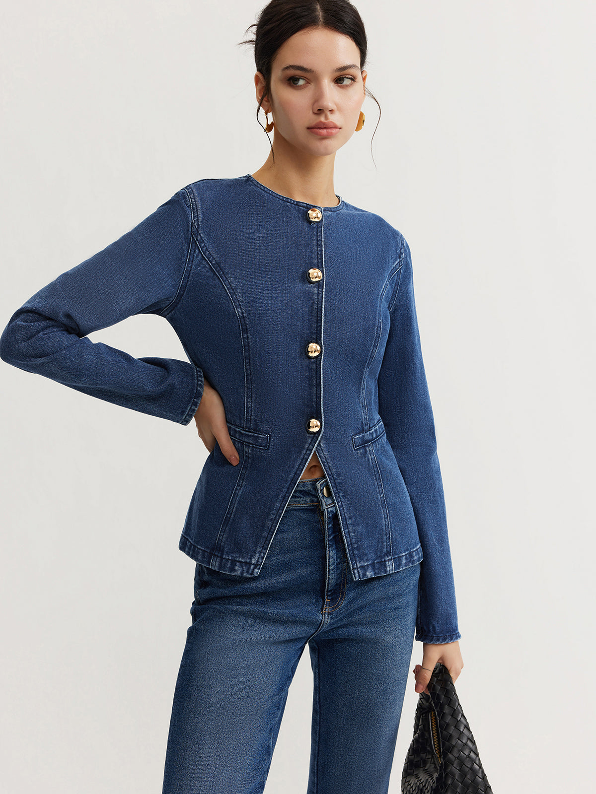 Women's slim fit denim jacket with front button closure and round neckline