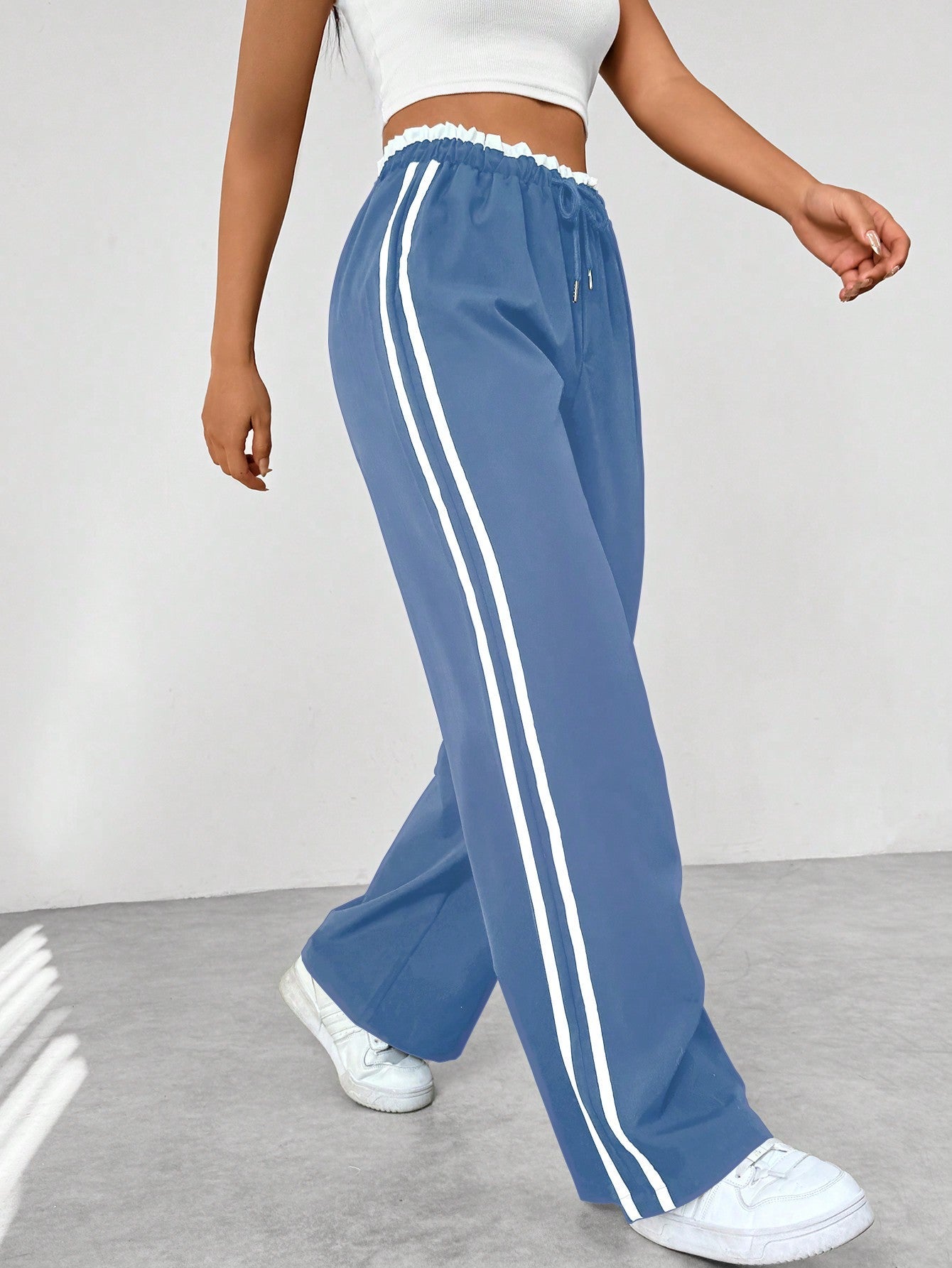 Women's lightweight wide-leg sweatpants with contrasting side stripes, front view