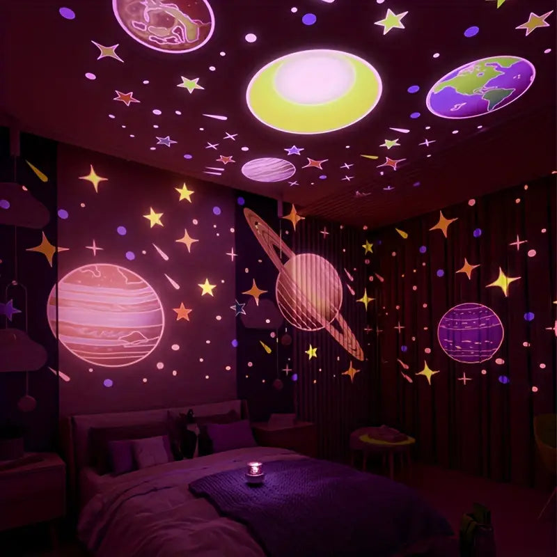 Rechargeable kids' star projector casting stars and planets onto a bedroom ceiling at night