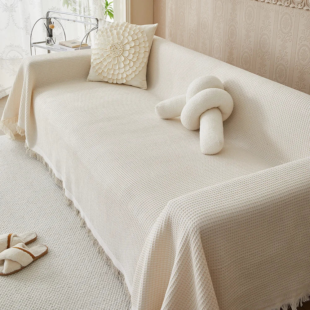 Waffle texture sofa cover draped over a living room sofa