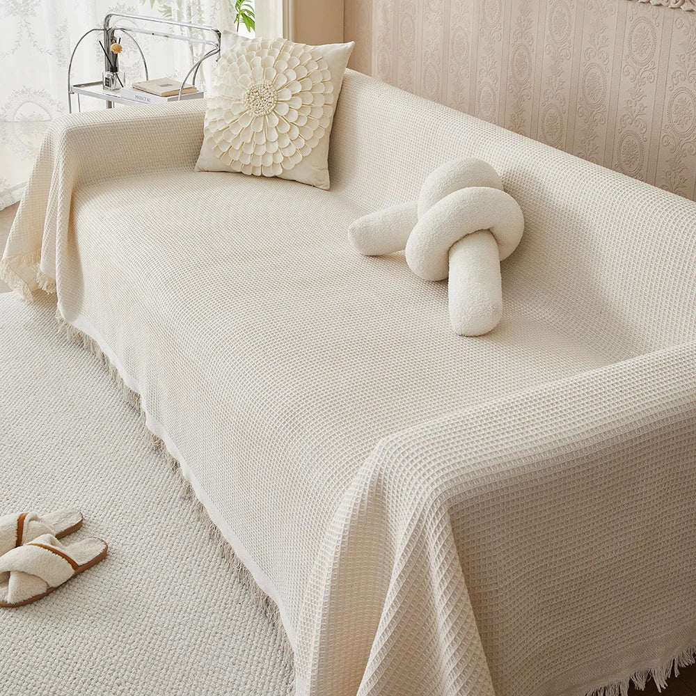 Waffle texture sofa cover shown from a front-facing angle on a sofa