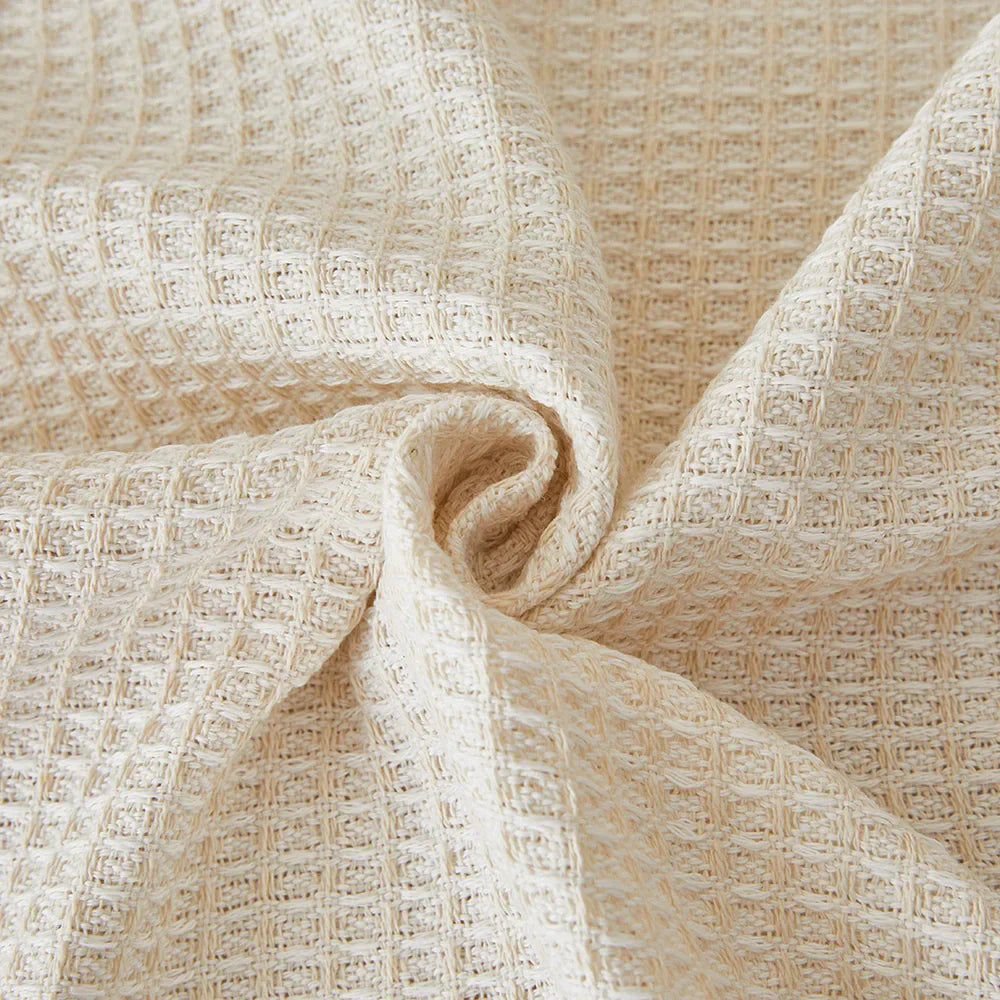 Side view of waffle texture sofa cover on a couch