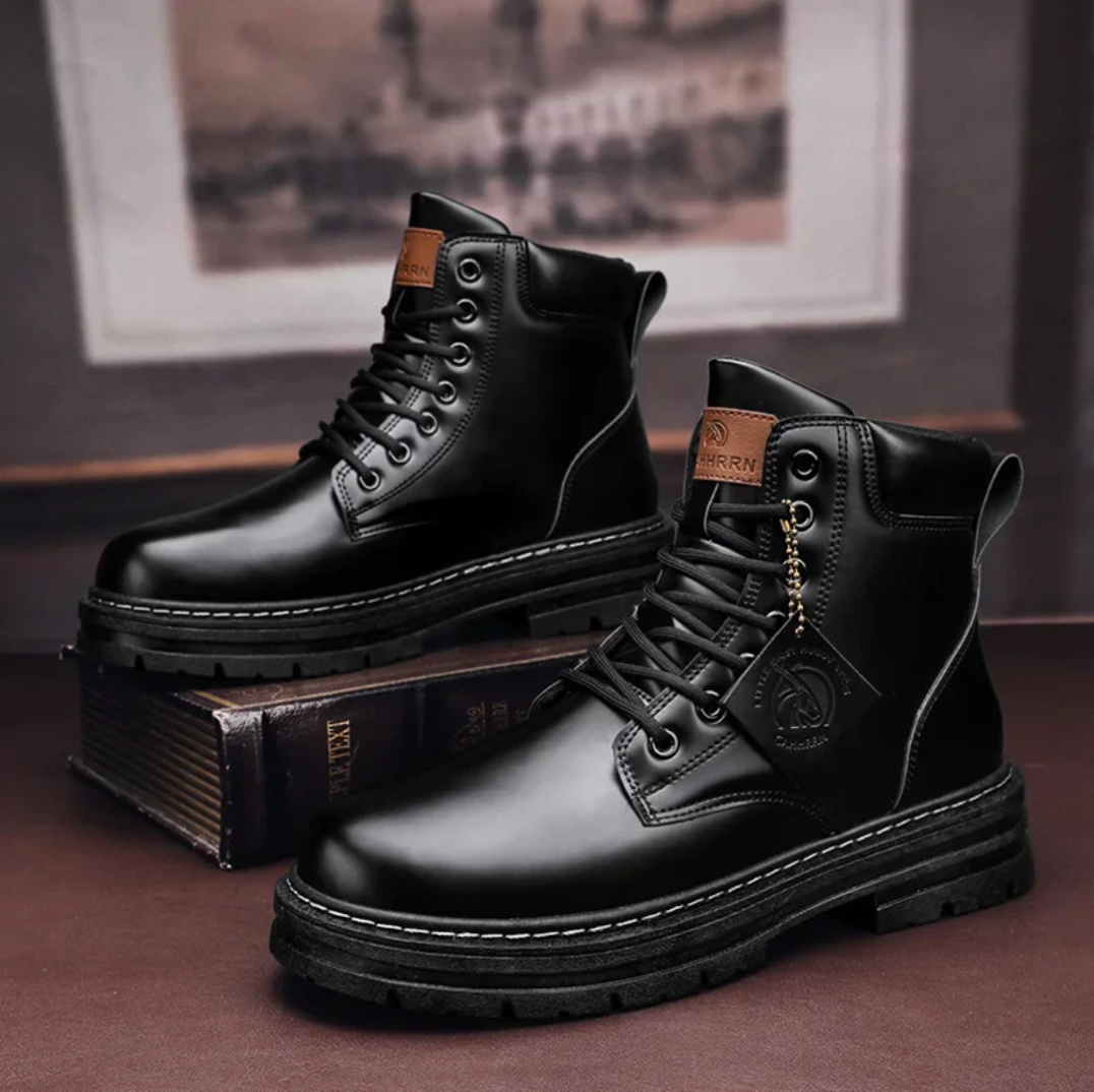 Men's lace-up boots — three-quarter angle view showing upper construction and lacing system