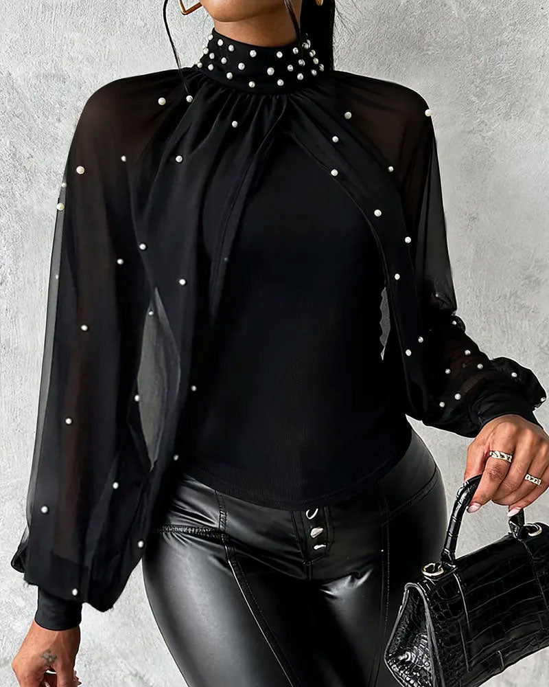 Women's long-sleeve decorative blouse with transparent sleeves, back view
