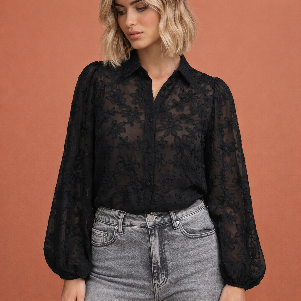 Transparent lace blouse with floral texture, front button closure, classic collar, and long sleeves with ruffled cuffs