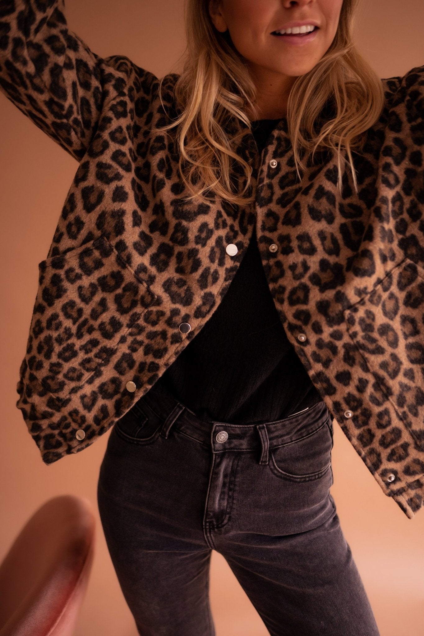 Women's leopard print jacket full-length front view showing snap button closure