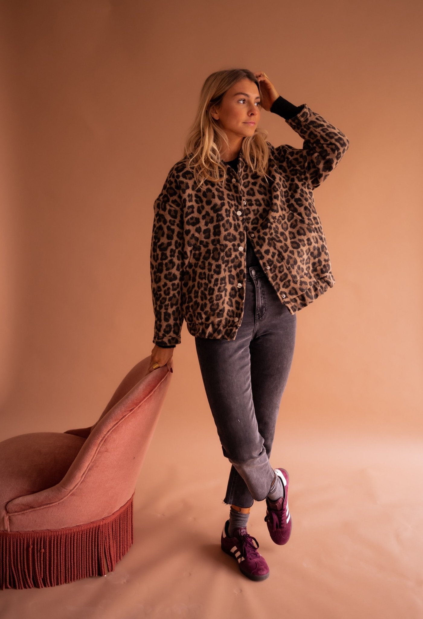 Women's leopard print jacket side profile showing relaxed fit and collar detail