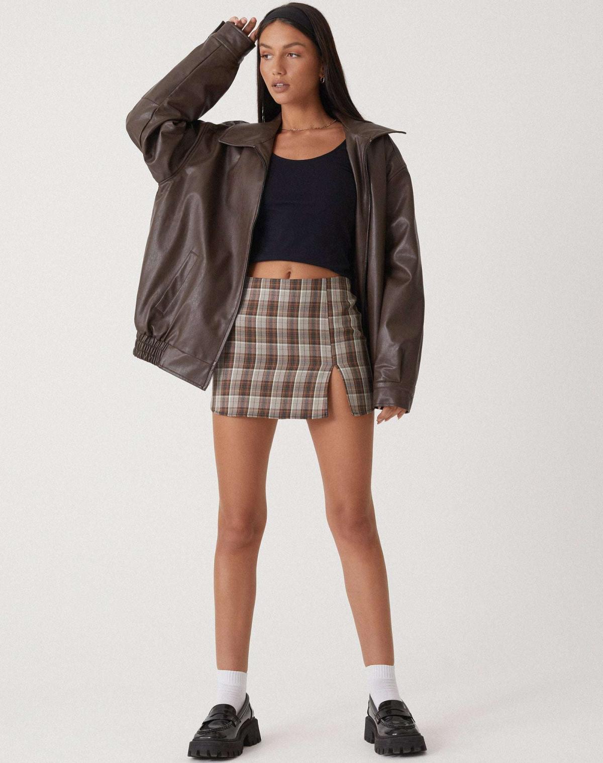 Oversized women's vegan leather jacket showing relaxed silhouette and hip-length cut, front-facing