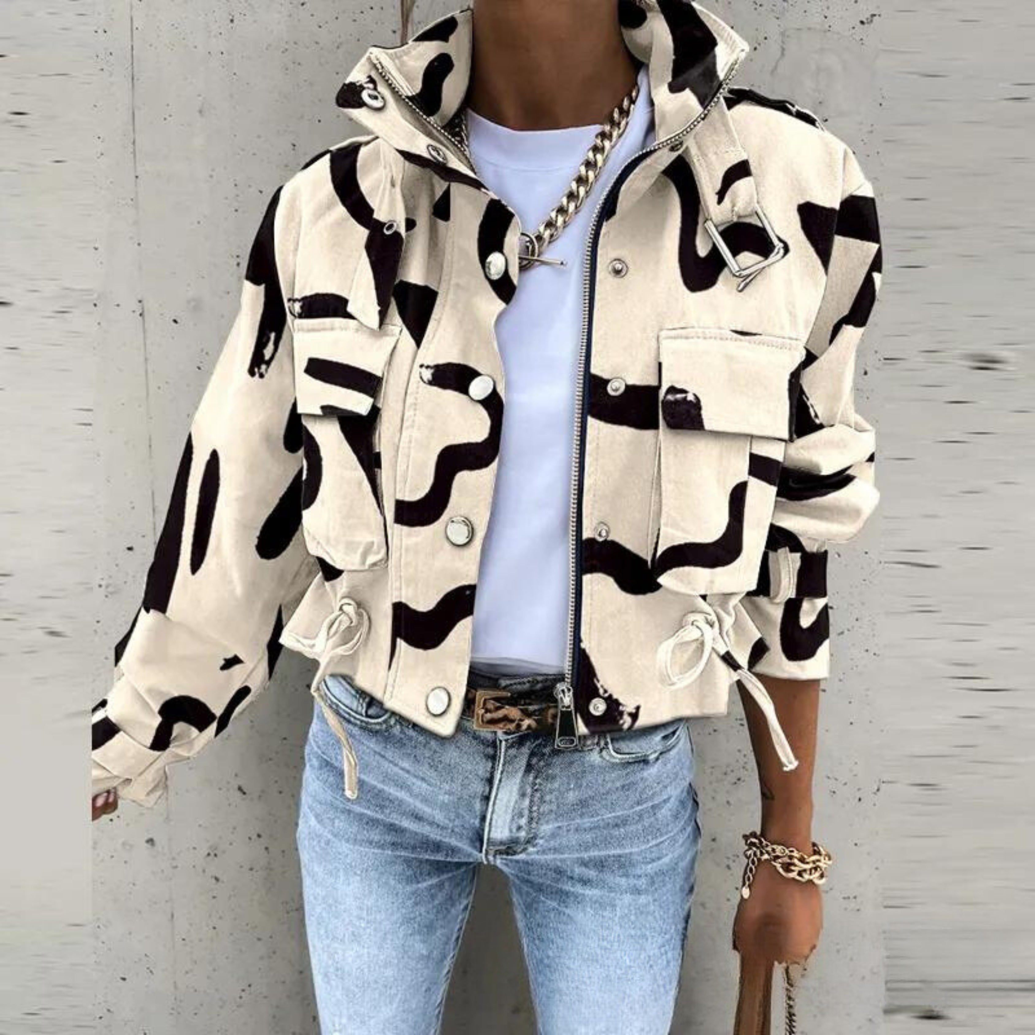 Cotton-blend women's utility jacket featuring a structured silhouette, snap button details, and waist-length cut
