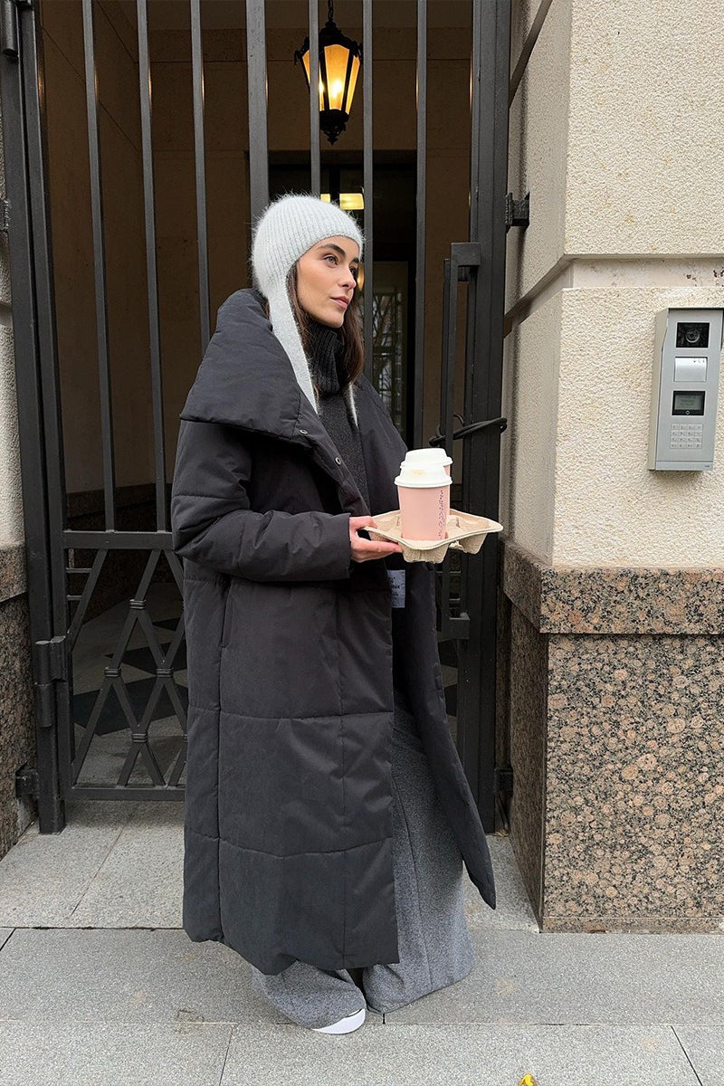 Long padded coat for women with wide collar and front closure detail
