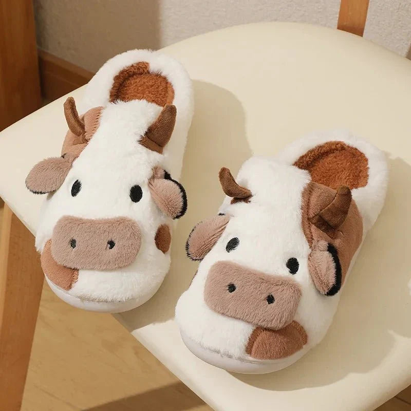 Plush house slippers with a slip-on design and closed toe on a flat sole
