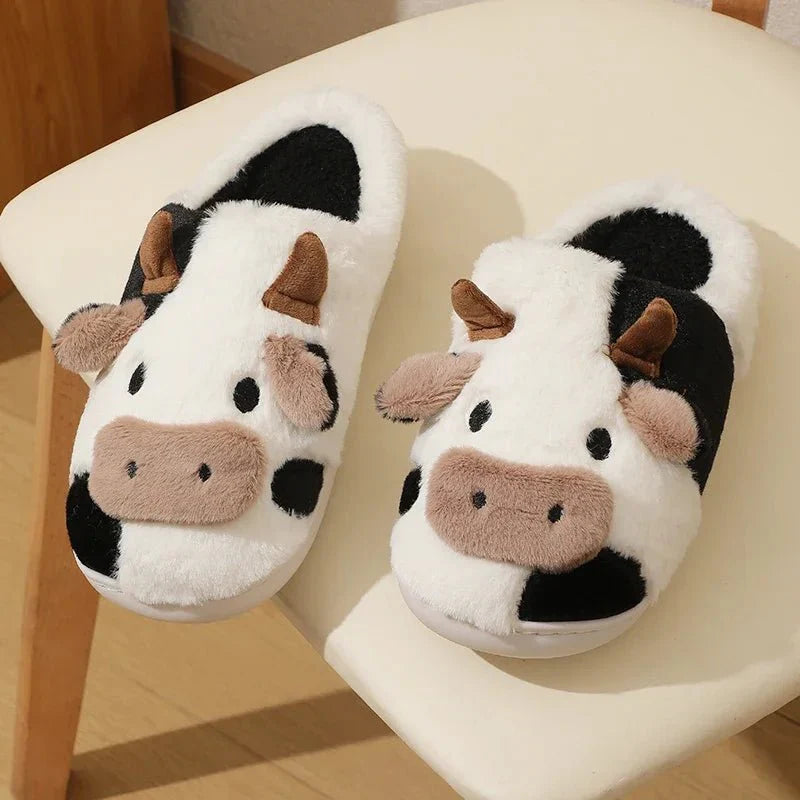 House slippers with a flat sole and closed toe designed for everyday indoor wear
