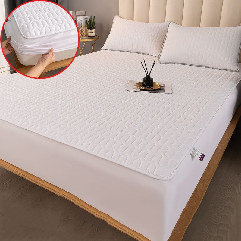 Quilted mattress protector folded to show padded interior and microfiber texture