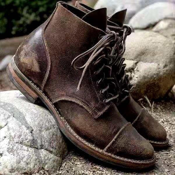 Men's leather ankle boots with front lacing and padded collar on flat sole