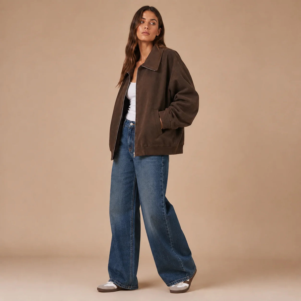Woman modeling brown collared zip jacket with relaxed fit