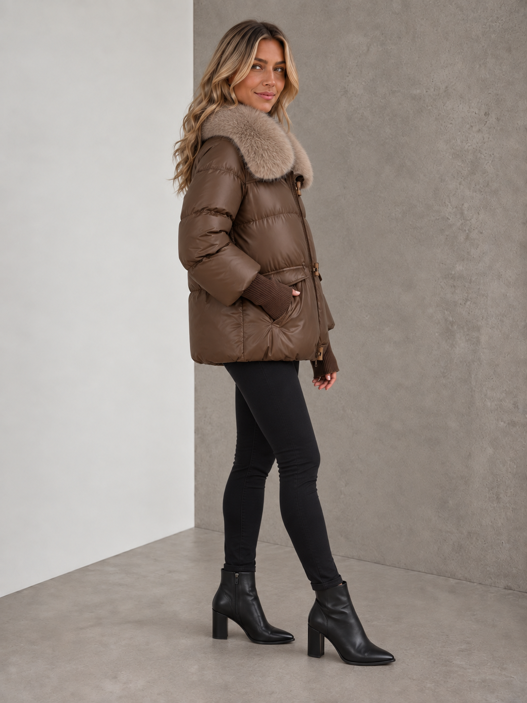 Women's light brown padded winter jacket with faux fur collar angled view
