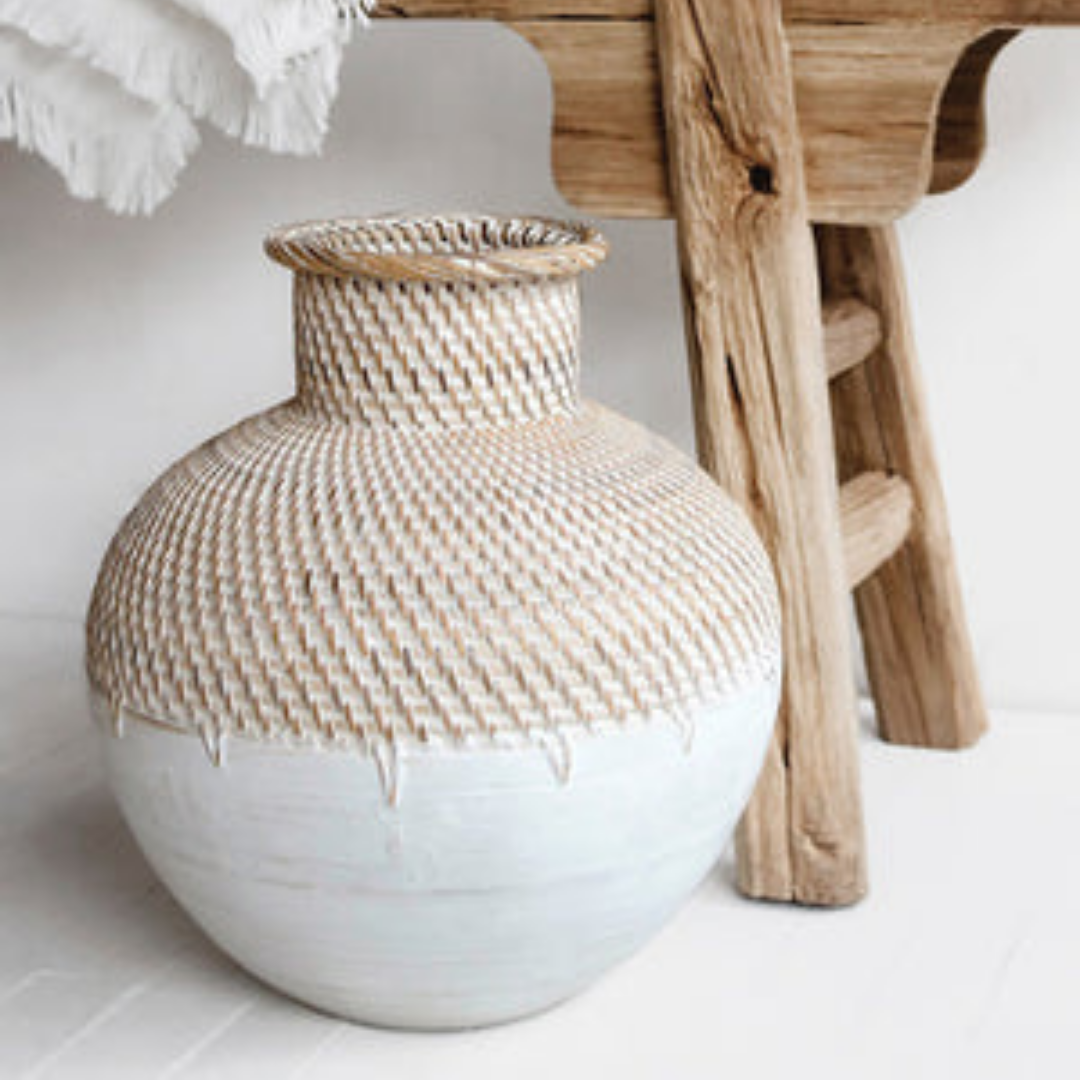 Close-up of handmade woven ceramic vase showing woven texture detail