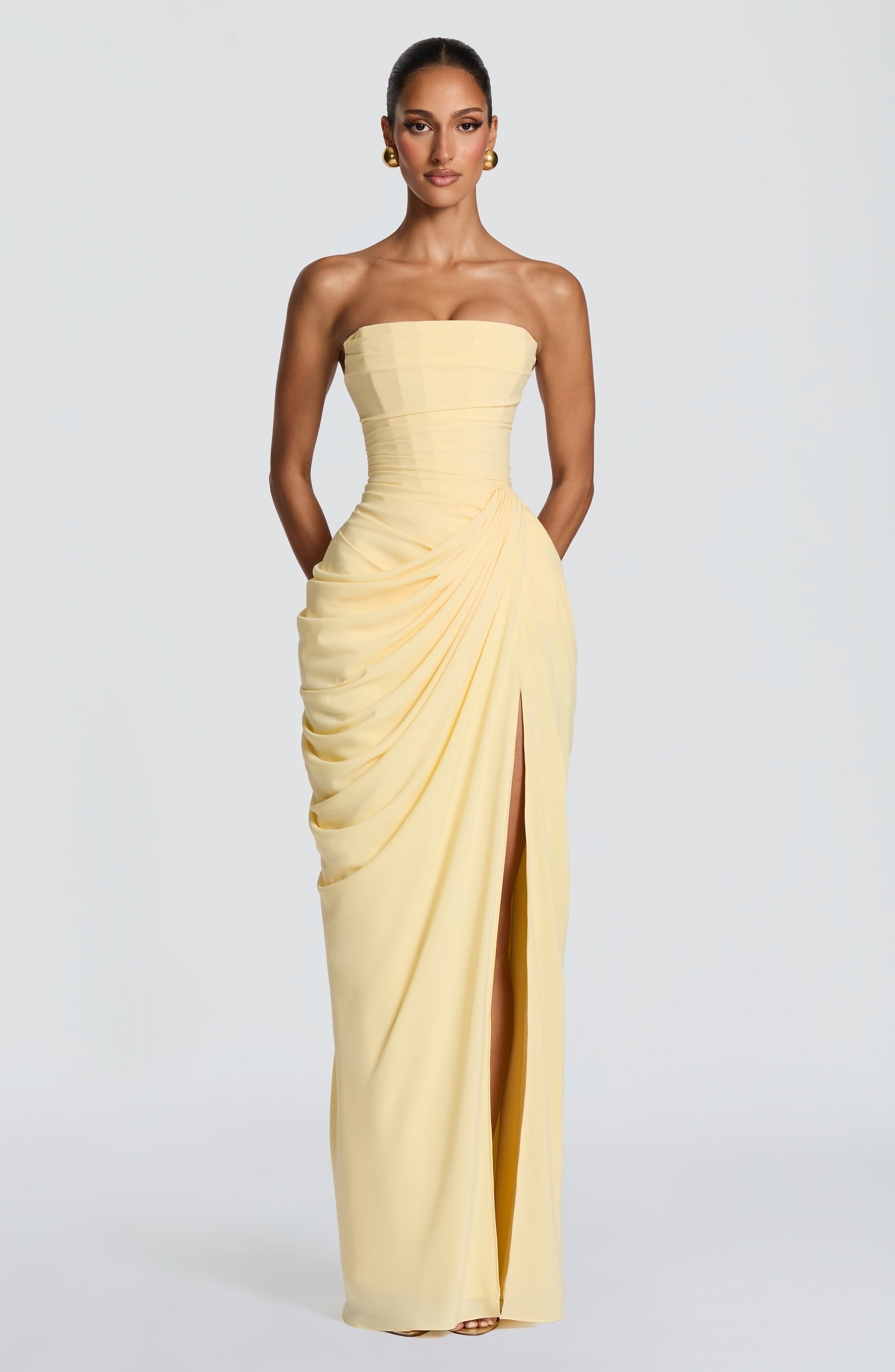 Draped strapless maxi dress with high side slit and full-length silhouette