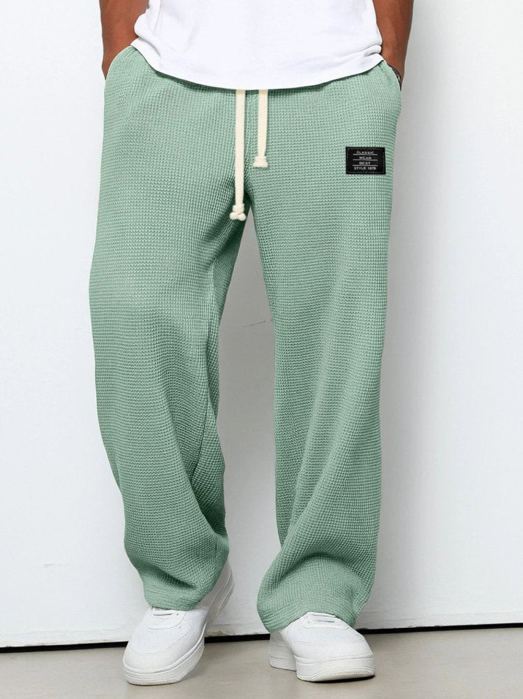 Men's casual waffle-knit trousers with side pockets and adjustable drawstring
