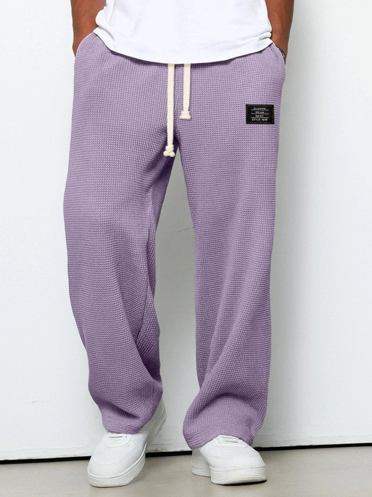 Men's waffle-knit trousers with elastic drawstring waistband and full-length relaxed fit