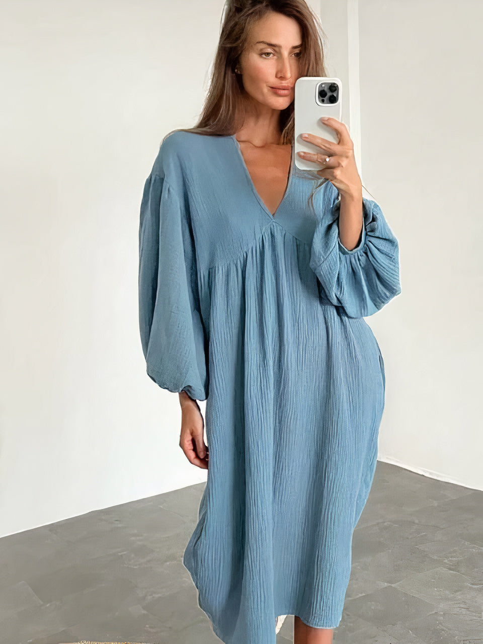 Women's flowing midi dress with V-neckline and long sleeves, relaxed fit in a lightly structured fabric