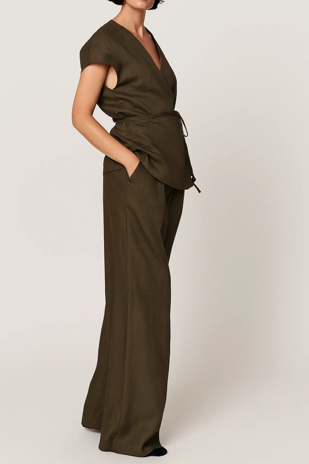 Women's two-piece set featuring a short-sleeve wrap top and full-length wide-leg pants