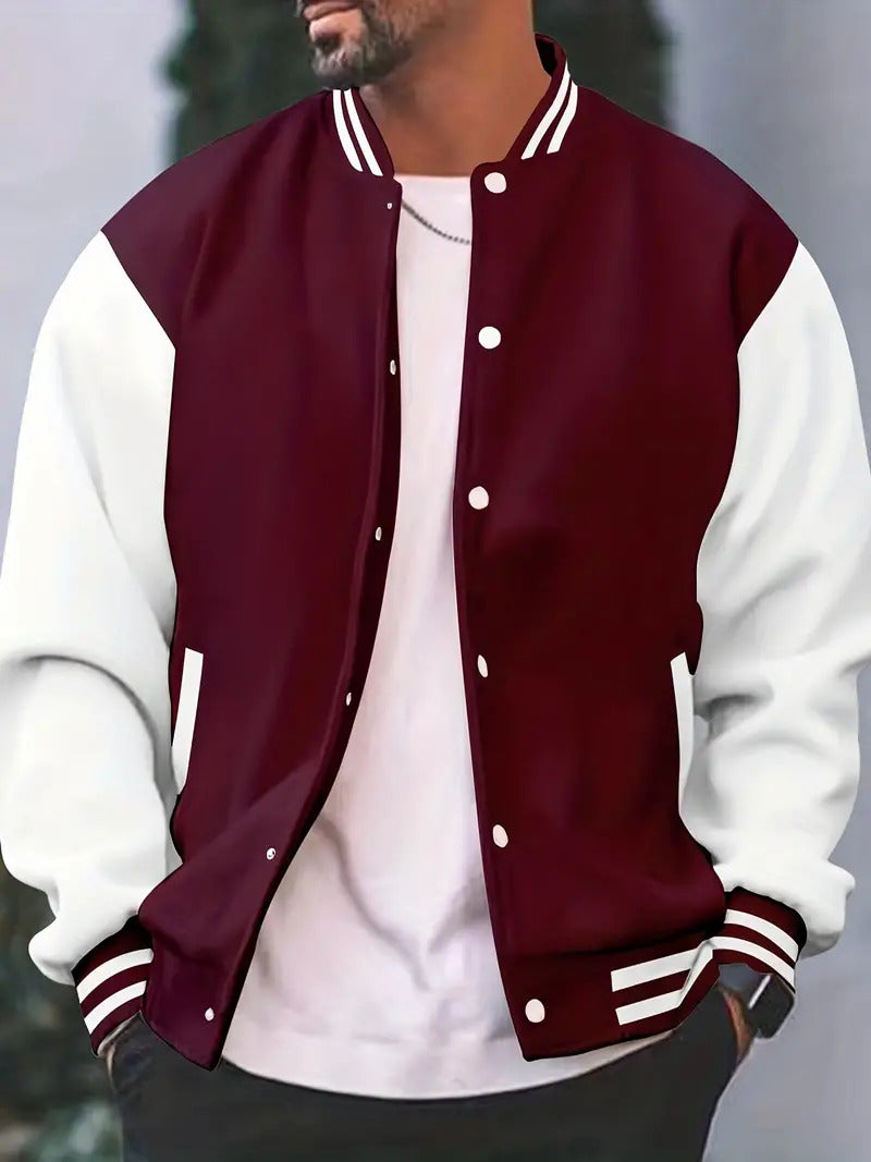 Men's varsity jacket with contrasting sleeves, snap button front, and ribbed hem