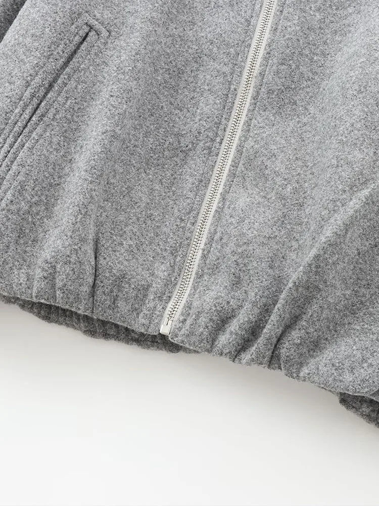 Women's short bomber-style jacket with side pockets and front zip closure