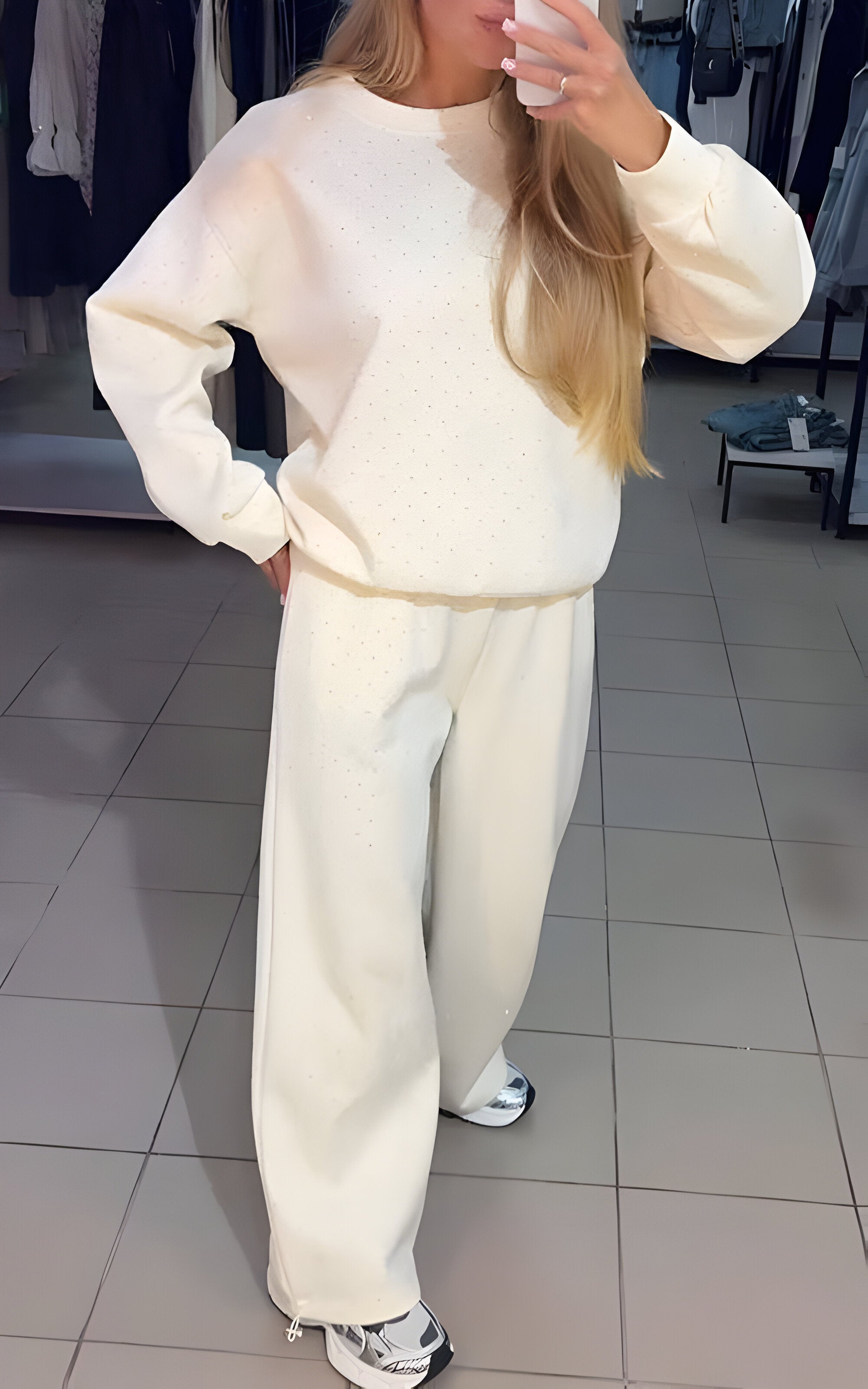 Women's matching lounge set featuring a long-sleeve top and full-length trousers with a relaxed silhouette