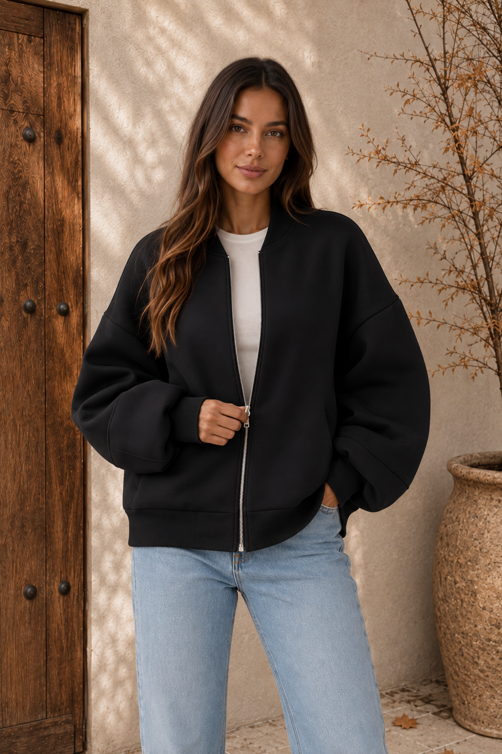 Women's oversized zip bomber jacket in black with modern relaxed fit