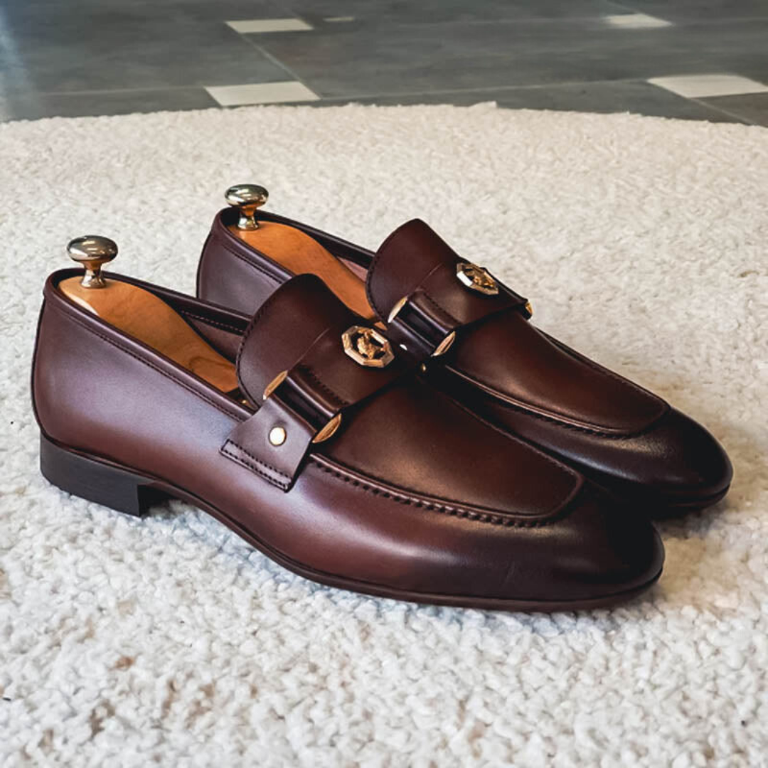Men's leather loafers with strap and metal detail, round toe and stitched edges