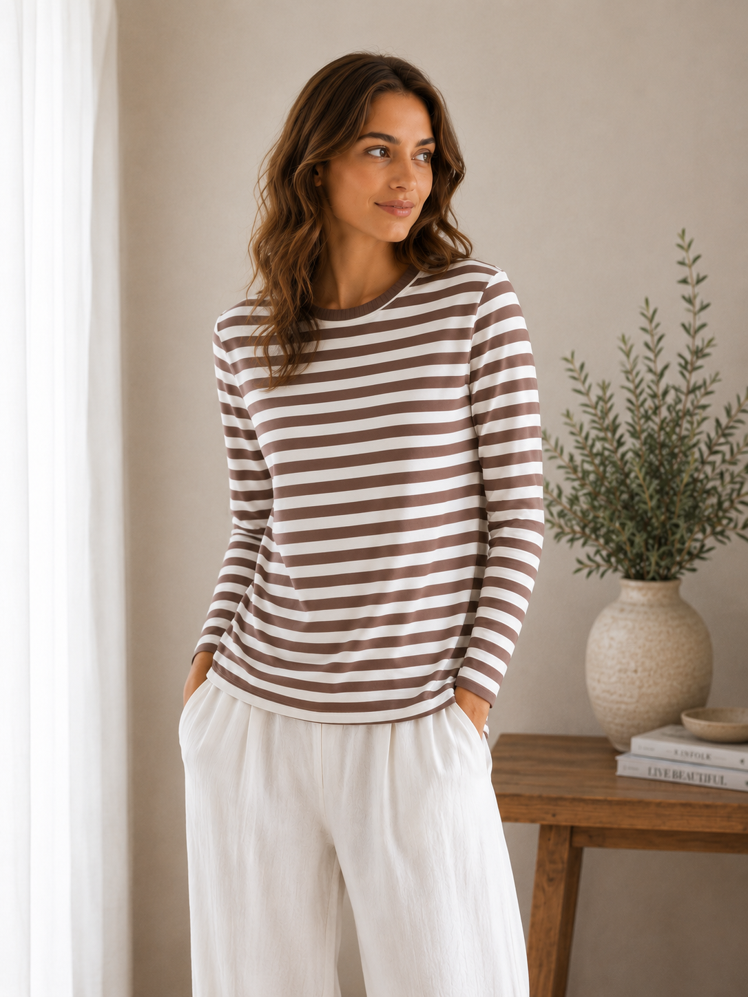 Women's pull-over knit top with horizontal stripes and round neckline