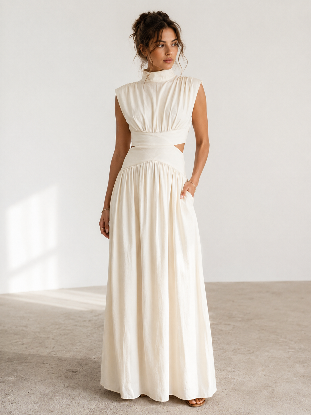 Women's long sleeveless dress with high neckline, defined waist, and side cut-out detail