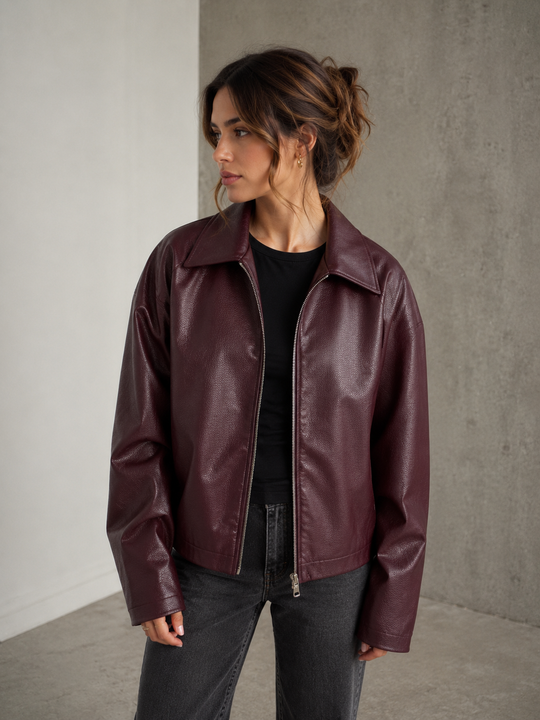 Faux leather women's jacket with structured silhouette and long sleeves