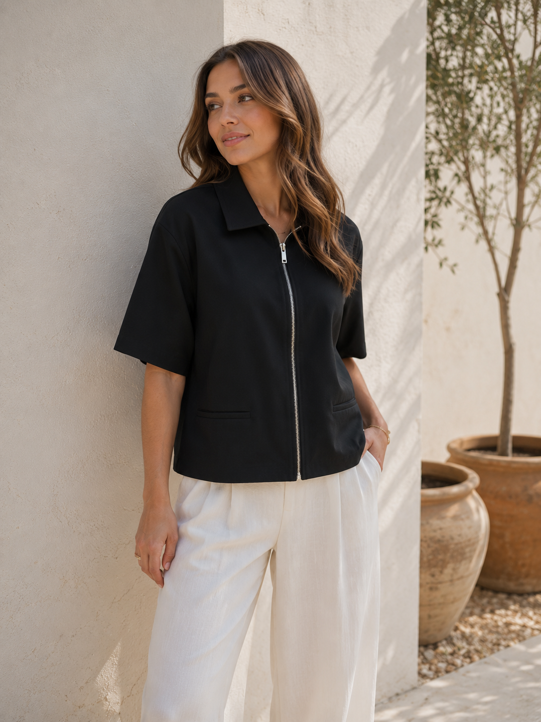Front zipper detail on cropped collared jacket