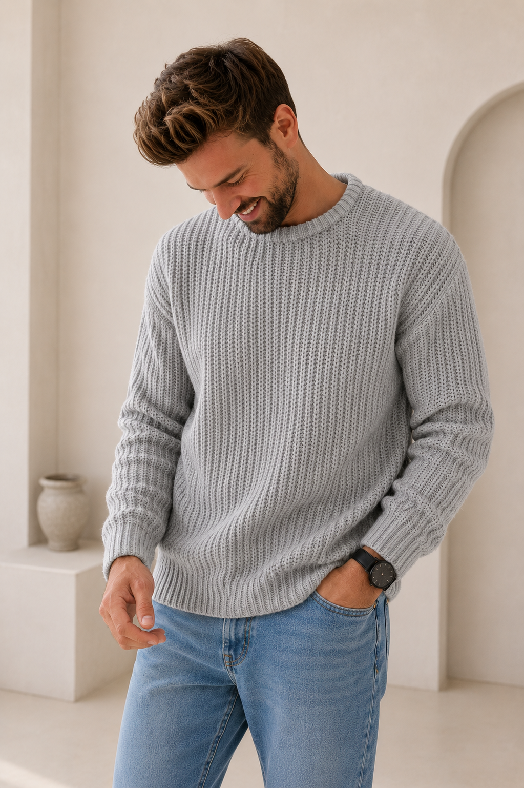 Men's chunky knit pullover sweater showing textured knit pattern, side view