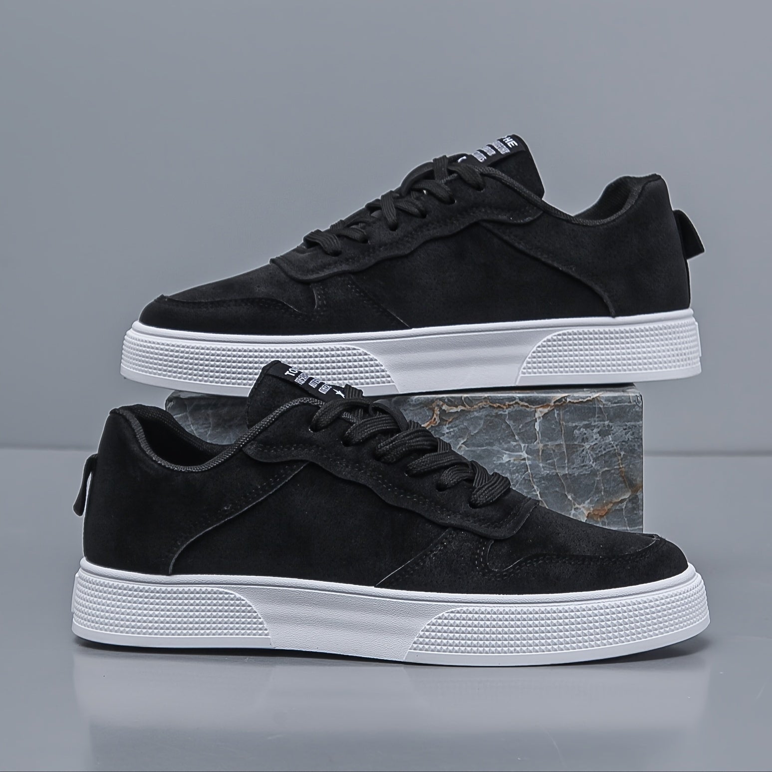 Side profile view of men's low-top canvas sneakers with rubber sole