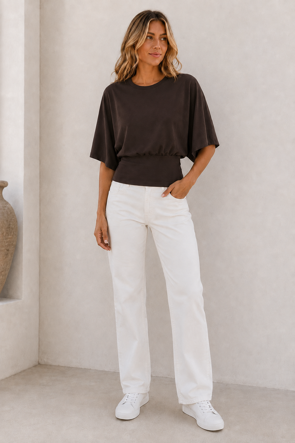 Women's draped short-sleeve top with fitted waist and round neckline