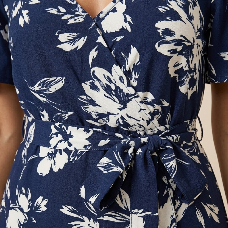 Women's cold-shoulder maxi dress featuring an all-over floral pattern and defined waist