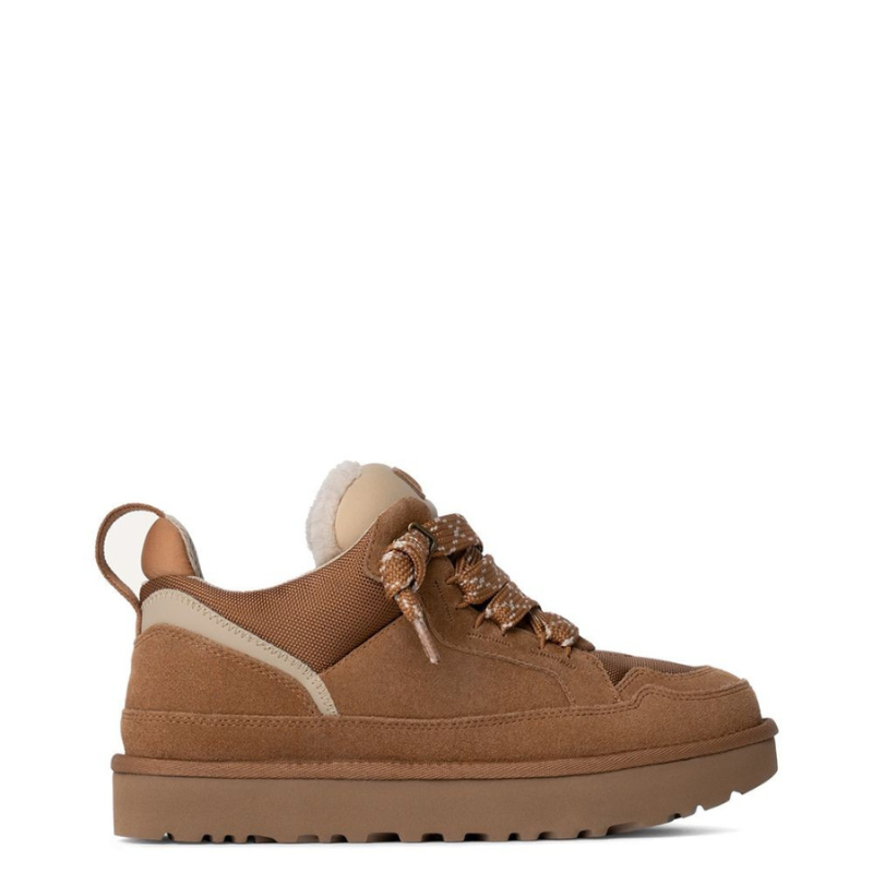 Women's low-top lace-up sneakers with layered panel construction and thick patterned rubber sole