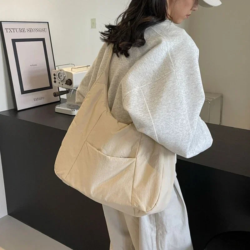 Quilted shoulder bag rear view with adjustable shoulder strap