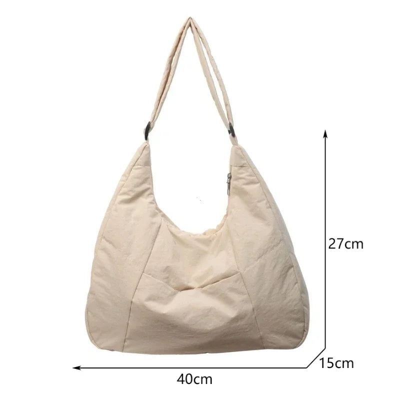 Padded shoulder bag top zipper closure close-up