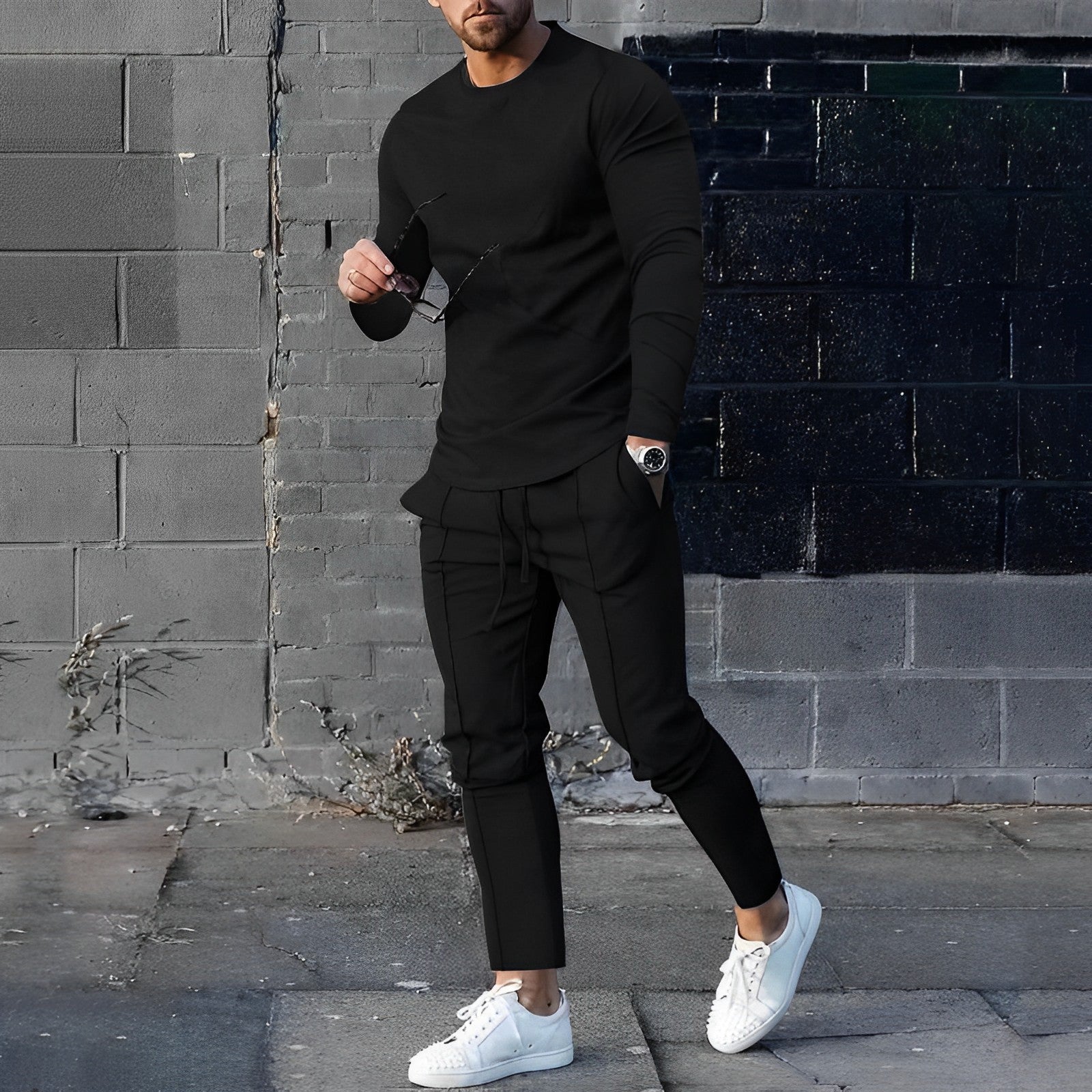 Men's training set in black — slim-fit round-neck sweater and tapered joggers, front view