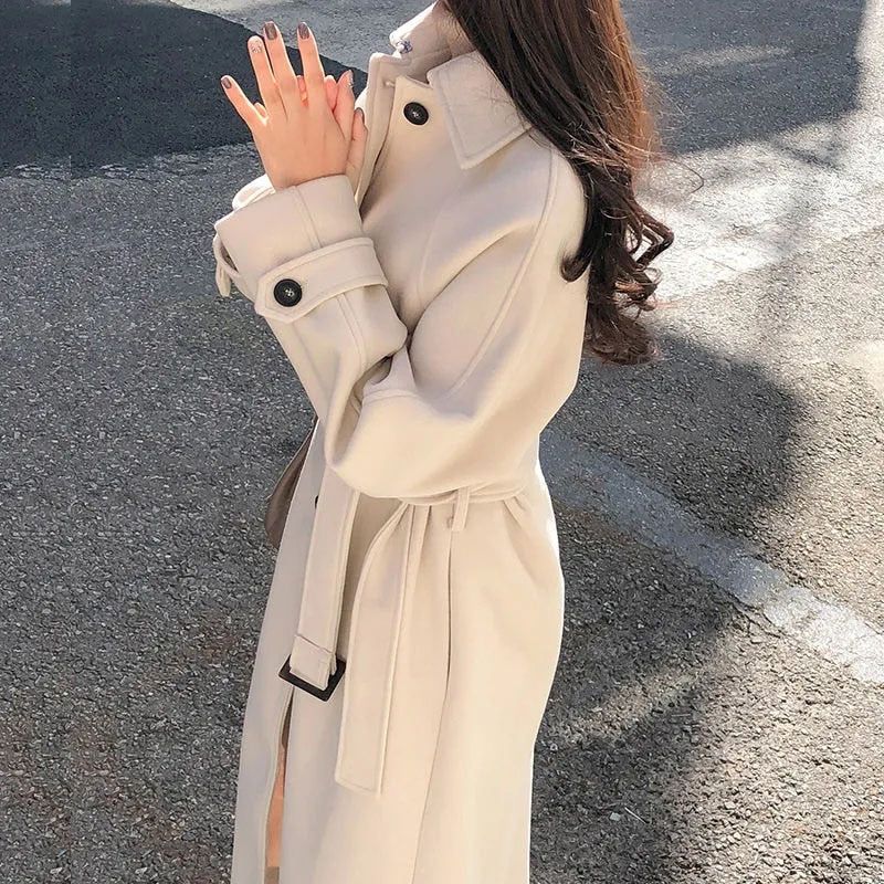 Women's long buttoned polyester coat showing back length and silhouette, full-length rear view