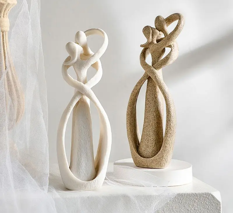 Romantic couple sculpture in minimalist abstract form, matte textured finish, front view
