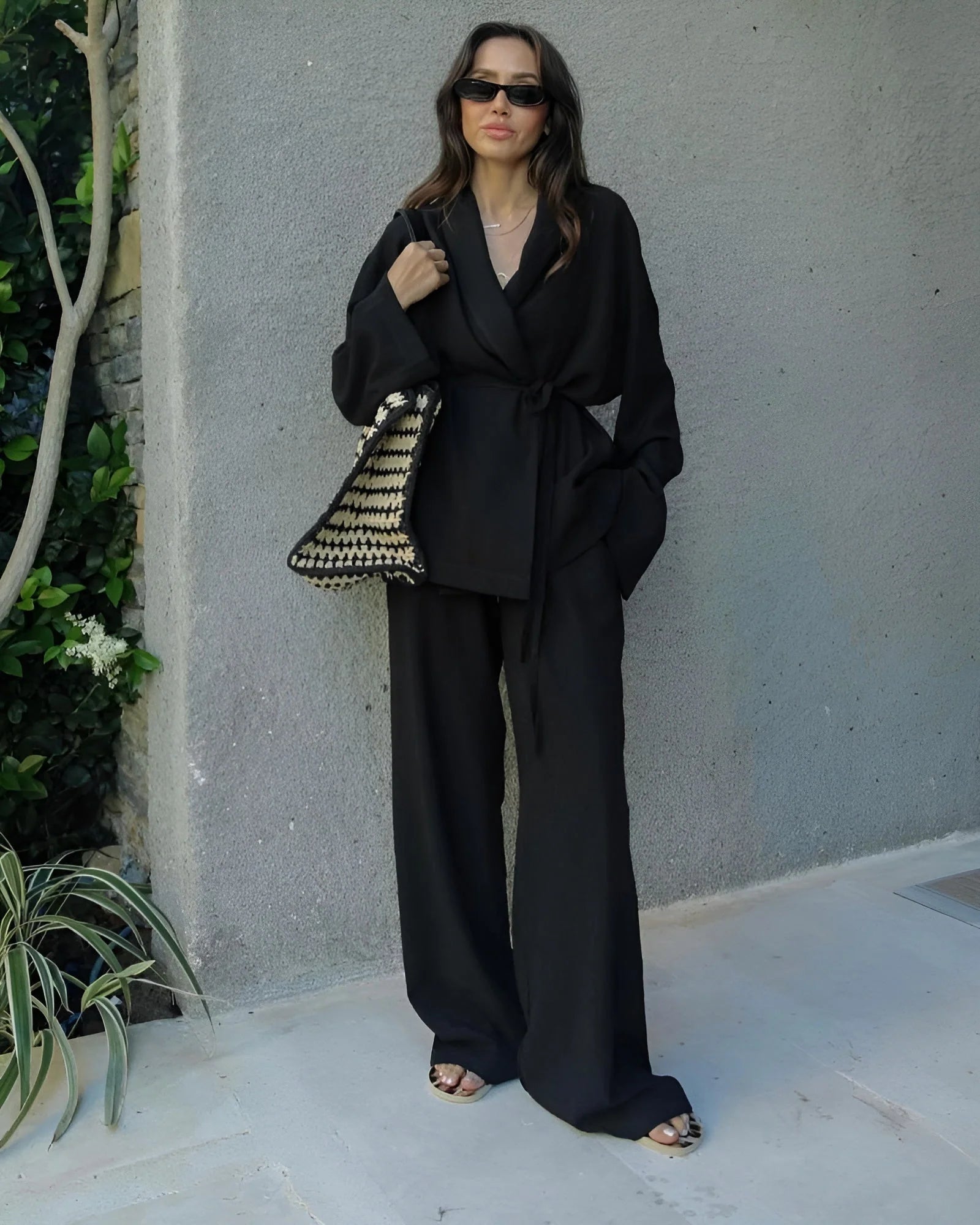 Women's wrap blouse and wide-leg trouser set with V-neck and tie-waist detail