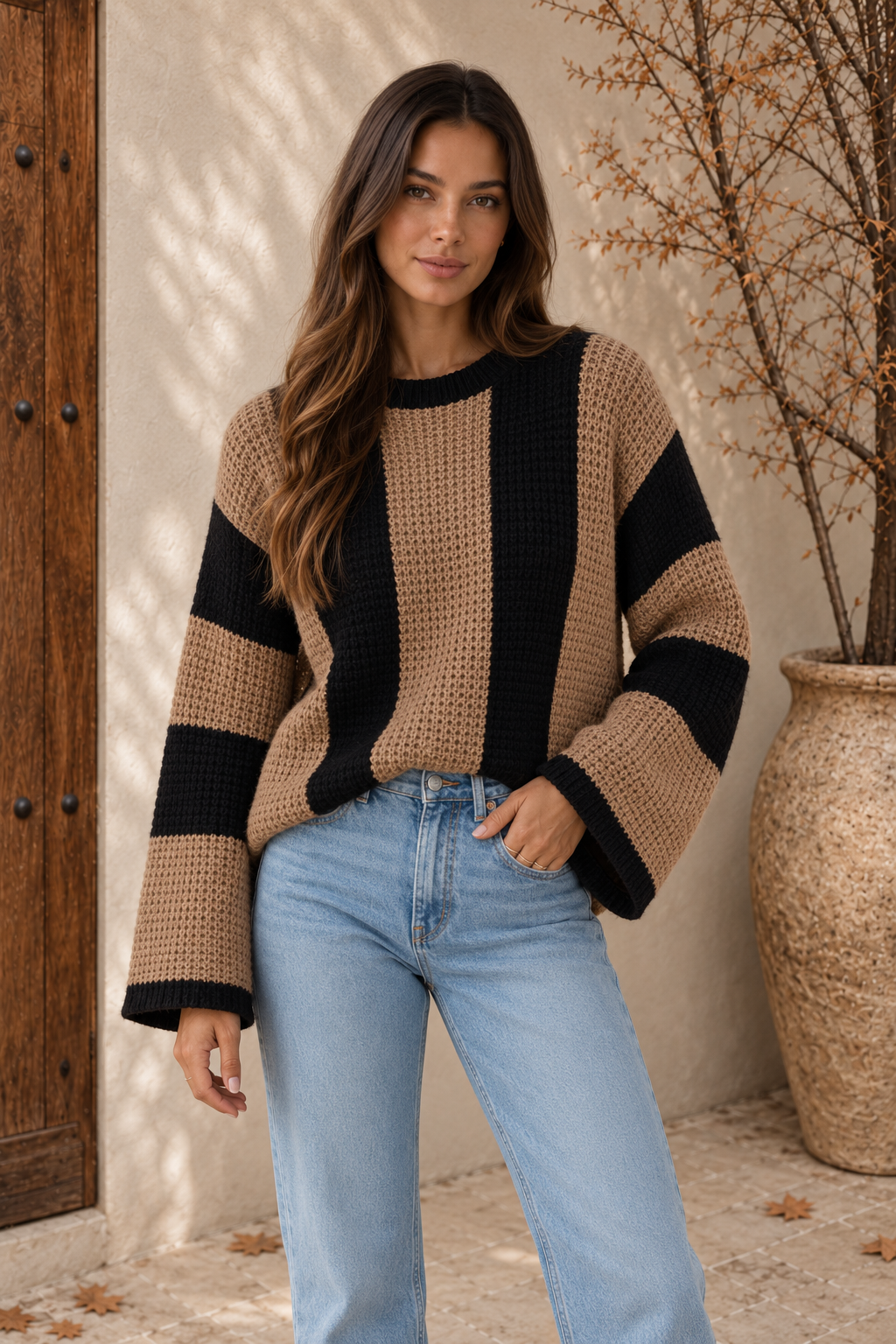 Women's camel and black striped chunky-knit sweater with ribbed round neck and oversized fit, front view