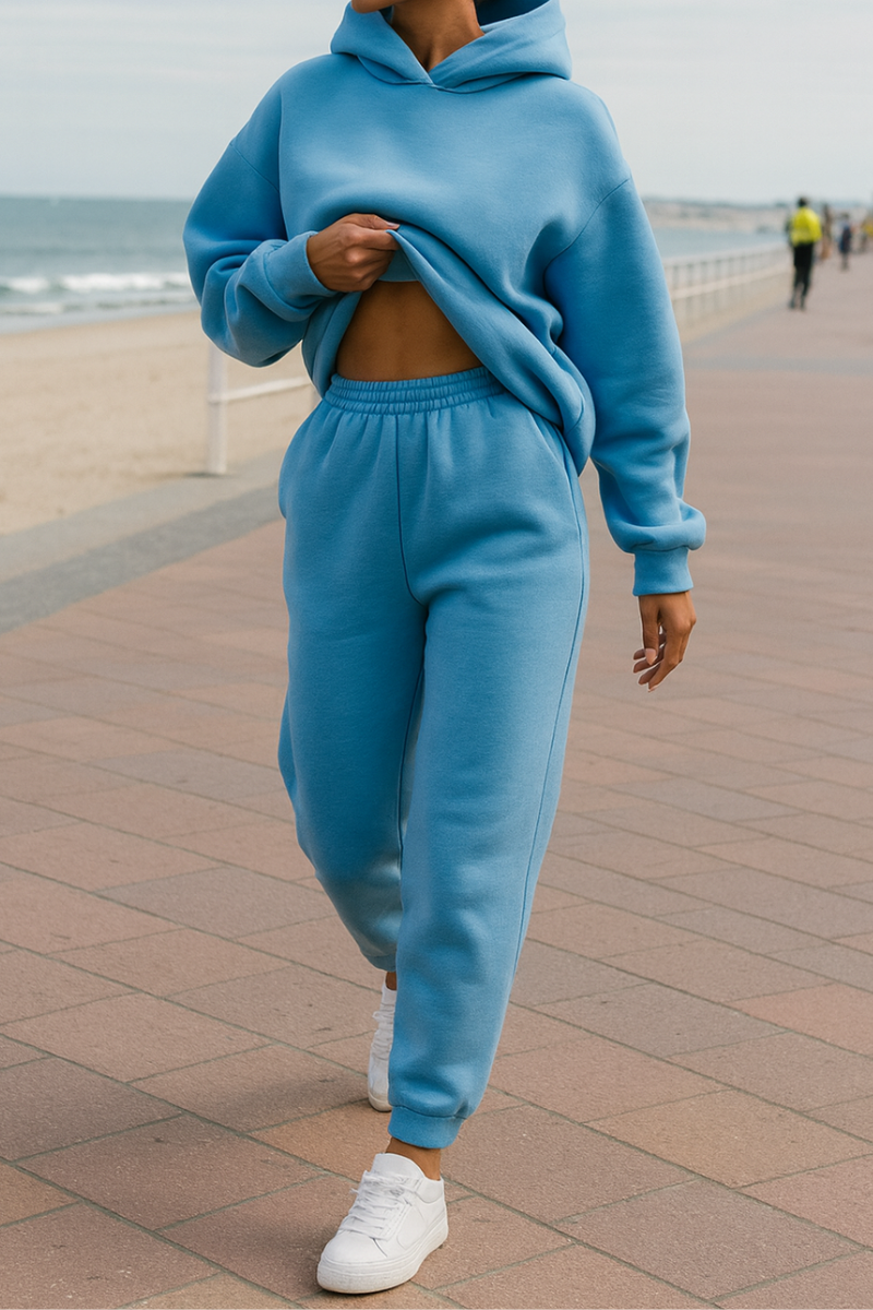 Women's pullover hoodie and elastic-waist jogger set, side profile full-length view