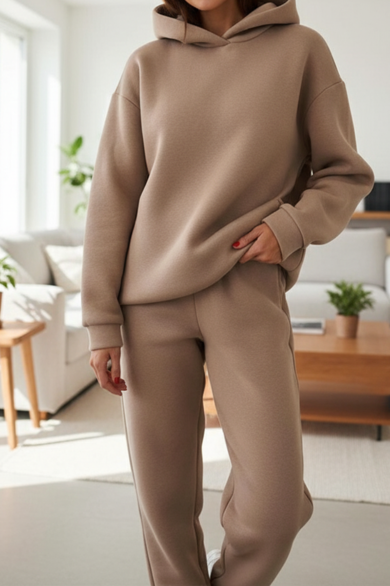 Women's two-piece lounge set with hoodie and jogger pants, rear view showing clean silhouette